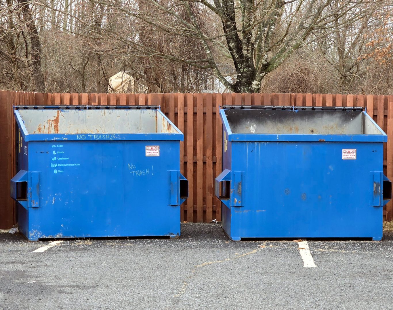 Two Blue Dumpsters, Trash, Garbage, Waste, Recycling, Waste Management, Containers, Receptacles, Bins in a Brown Wood Fenced Enclosure, at a Public Park in New Jersey, Stock Photo, Sanitation