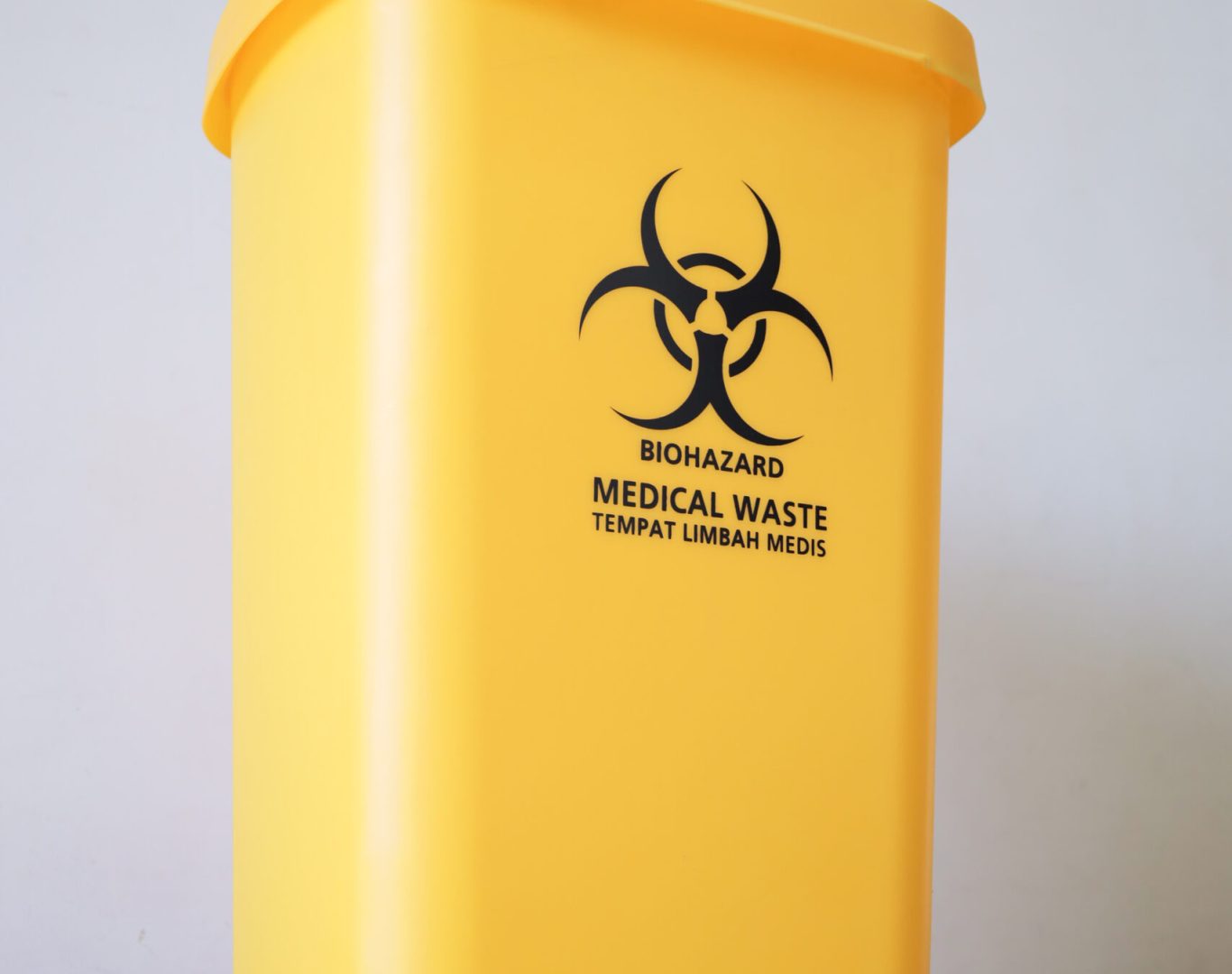 Medical waste bin. Biohazard contaminated waste sign trash garbage bin.